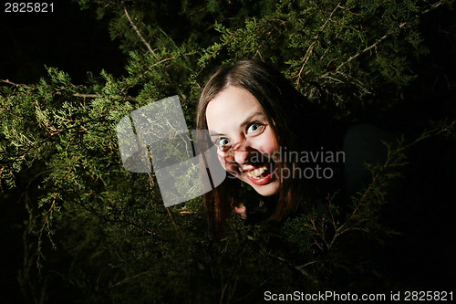 Image of Girl goofing in trees