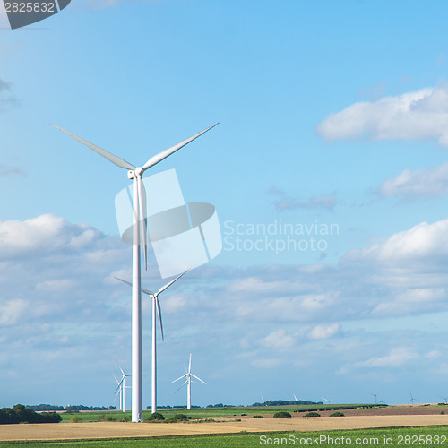 Image of Wind generators turbines on summer landscape