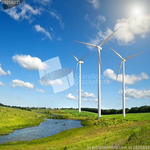 Image of Wind generators turbines on summer landscape