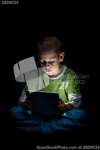 Image of Boy holding tablet 