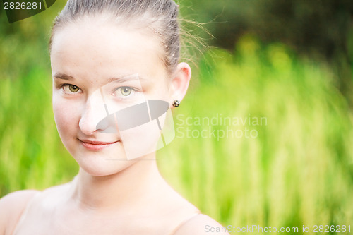 Image of Portrait of face young beautiful girl woman on green outdoor bac
