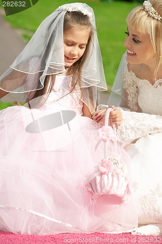 Image of happy bride and little bridesmaid