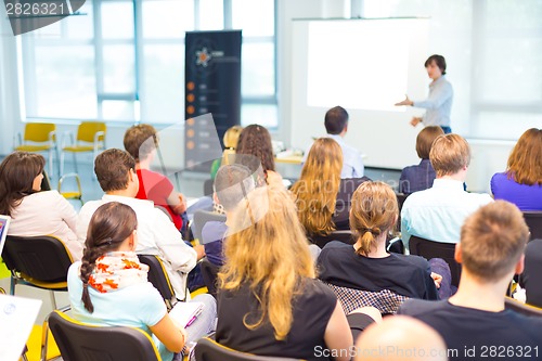 Image of Speaker at Business convention and Presentation.