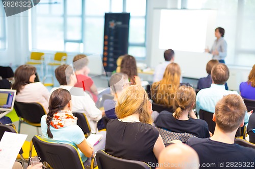 Image of Speaker at Business convention and Presentation.