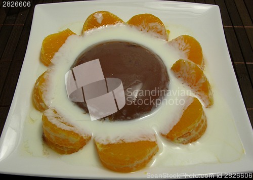 Image of Chocolate pudding with yoghurt and sliced tangerines