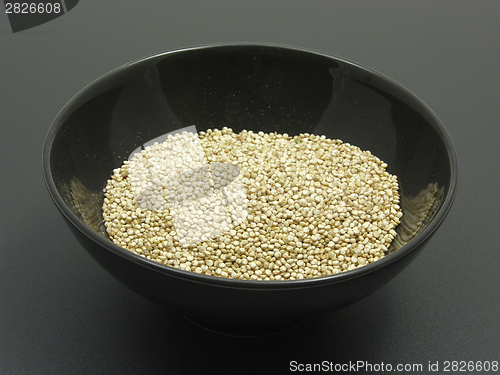 Image of Bowl of chinaware with quinoa on a dull matting