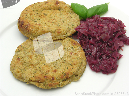 Image of Round flat potato dough cakes with basil and red cabbage