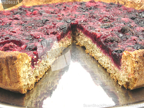 Image of Cutted berry cake on a cake tray