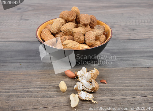 Image of Peanuts on wood