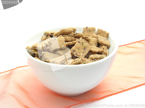 Image of A bowl of chinaware filled with dog cookies