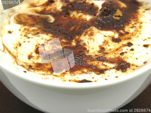 Image of Yogurt floured with chocolate in a bowl of chinaware