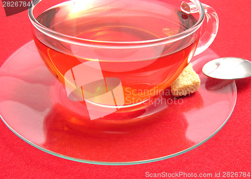 Image of Tea cup with rose hip tea on a placemat