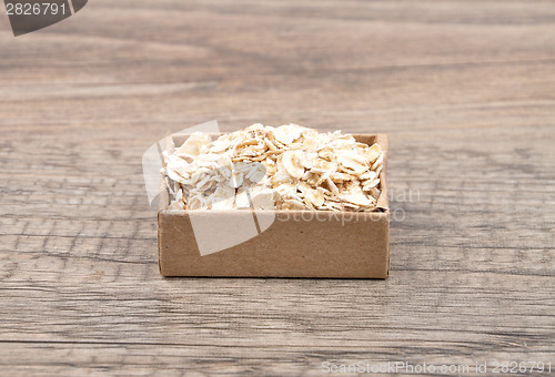 Image of Oat flakes on wood
