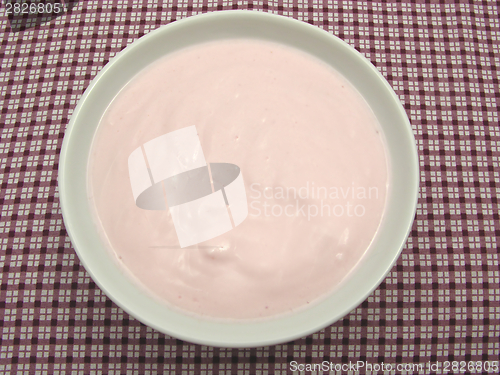 Image of Curd cheese in a bowl of chinaware on checked  tablecloth 