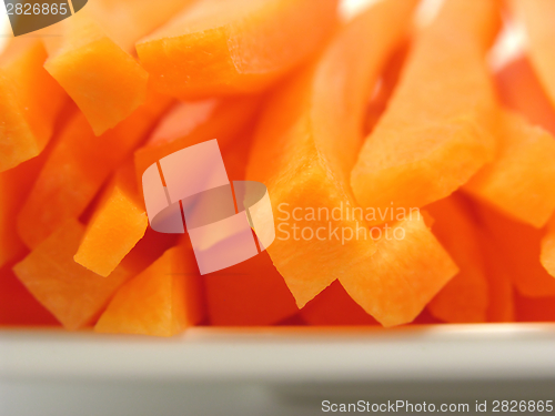 Image of Julienne carrots on a white plate and white background