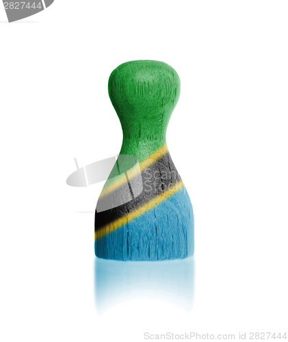 Image of Wooden pawn with a flag painting