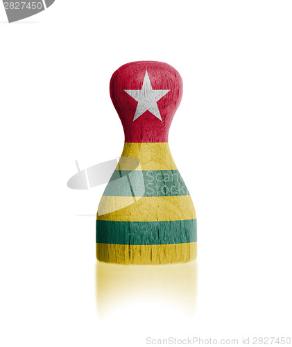 Image of Wooden pawn with a flag painting
