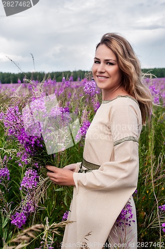 Image of Beautiful smiling girl on meadow