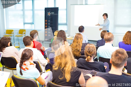 Image of Speaker at Business convention and Presentation.