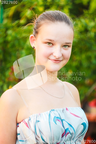 Image of Portrait of face young beautiful girl woman on green outdoor bac