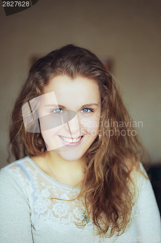 Image of Beautiful girl at home looking very happy