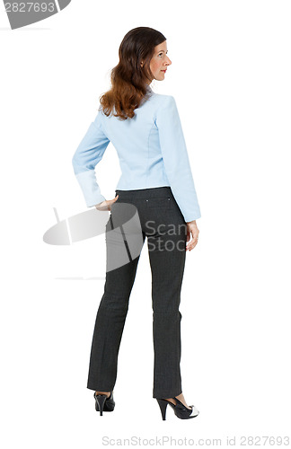 Image of woman standing with his back on a white background
