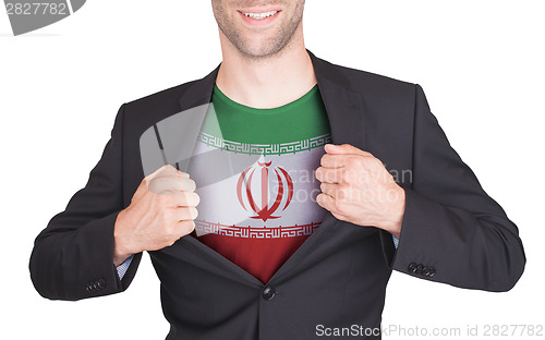 Image of Businessman opening suit to reveal shirt with flag