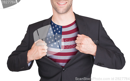 Image of Businessman opening suit to reveal shirt with flag