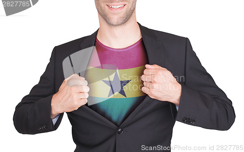 Image of Businessman opening suit to reveal shirt with flag