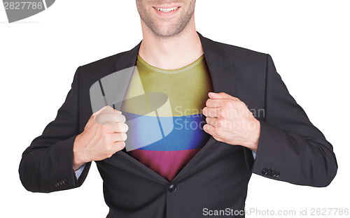 Image of Businessman opening suit to reveal shirt with flag