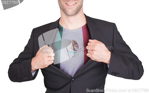 Image of Businessman opening suit to reveal shirt with flag