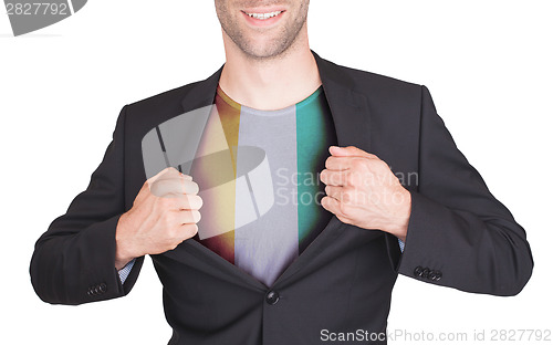 Image of Businessman opening suit to reveal shirt with flag