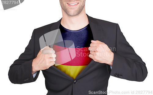 Image of Businessman opening suit to reveal shirt with flag