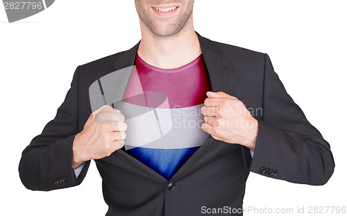 Image of Businessman opening suit to reveal shirt with flag