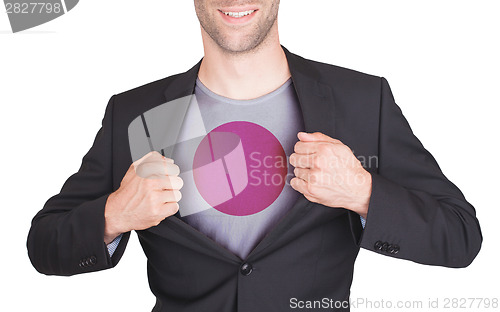 Image of Businessman opening suit to reveal shirt with flag