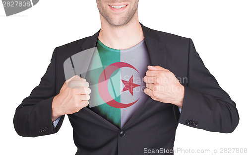 Image of Businessman opening suit to reveal shirt with flag