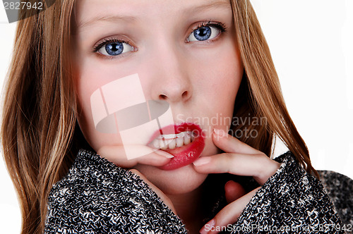 Image of Girl with finger on lips.