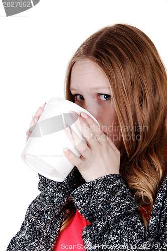 Image of Girl drinking from big mug.
