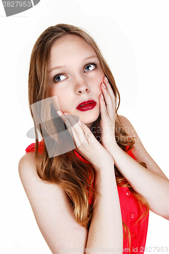 Image of Girl holding her face.