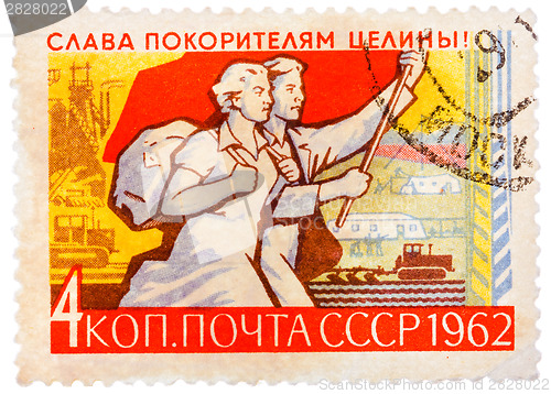 Image of Stamp printed in Russia shows Farm and Young Couple with Banner,