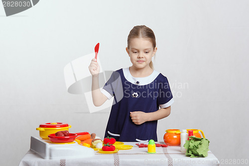 Image of Girl chooses vegetable soup