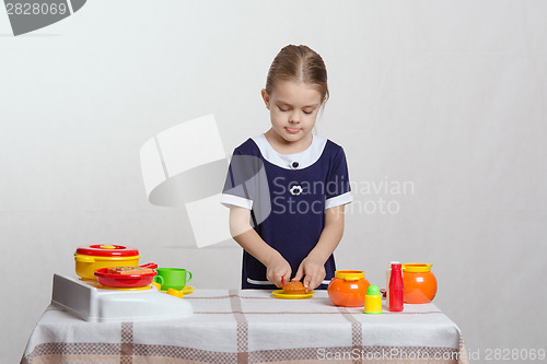 Image of Girl cuts delicious pie