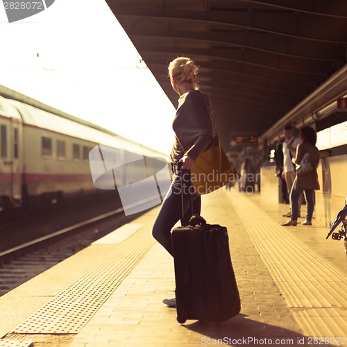 Image of Lady waiting at the railway station.