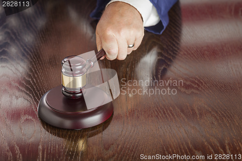 Image of Judge Slams Gavel and American Flag Table Reflection