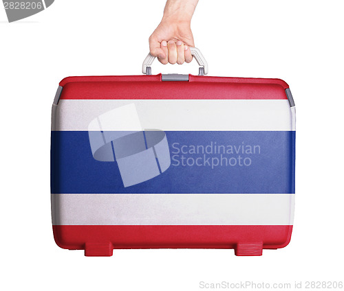 Image of Used plastic suitcase with stains and scratches