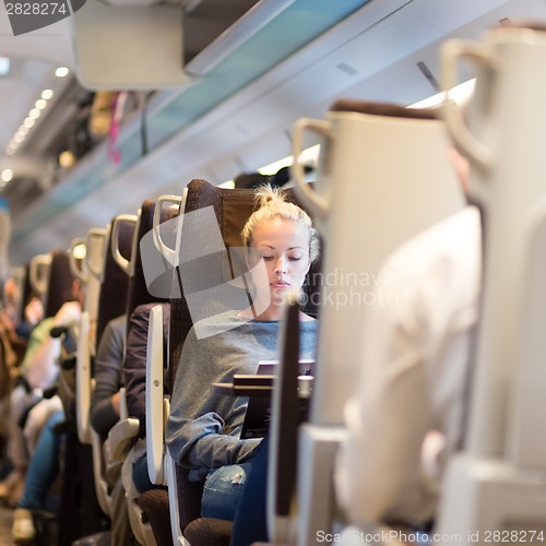 Image of Lady waiting at the railway station.