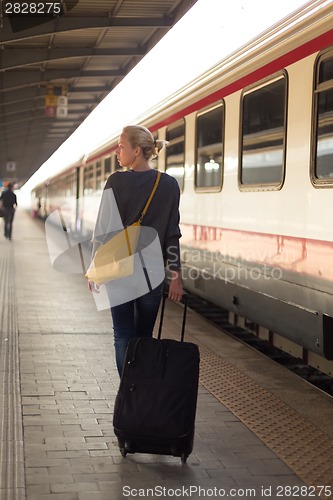 Image of Lady waiting at the railway station.