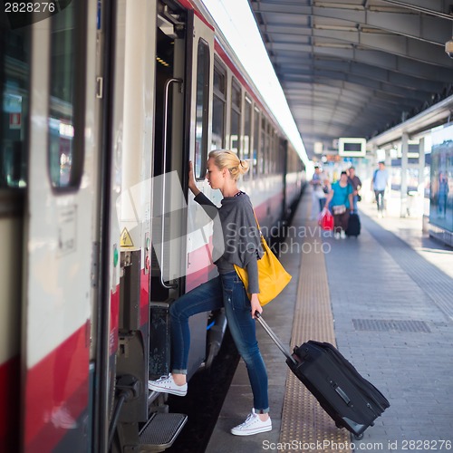 Image of Lady waiting at the railway station.