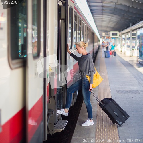 Image of Lady waiting at the railway station.