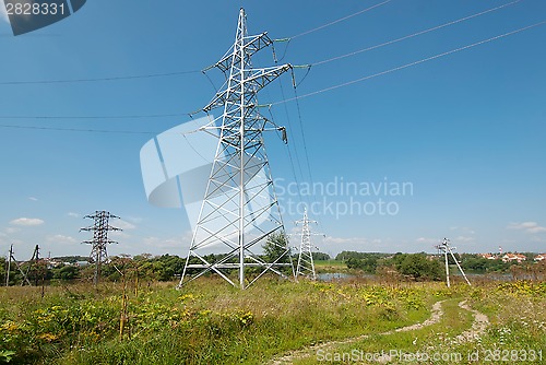 Image of Metal electric post on field